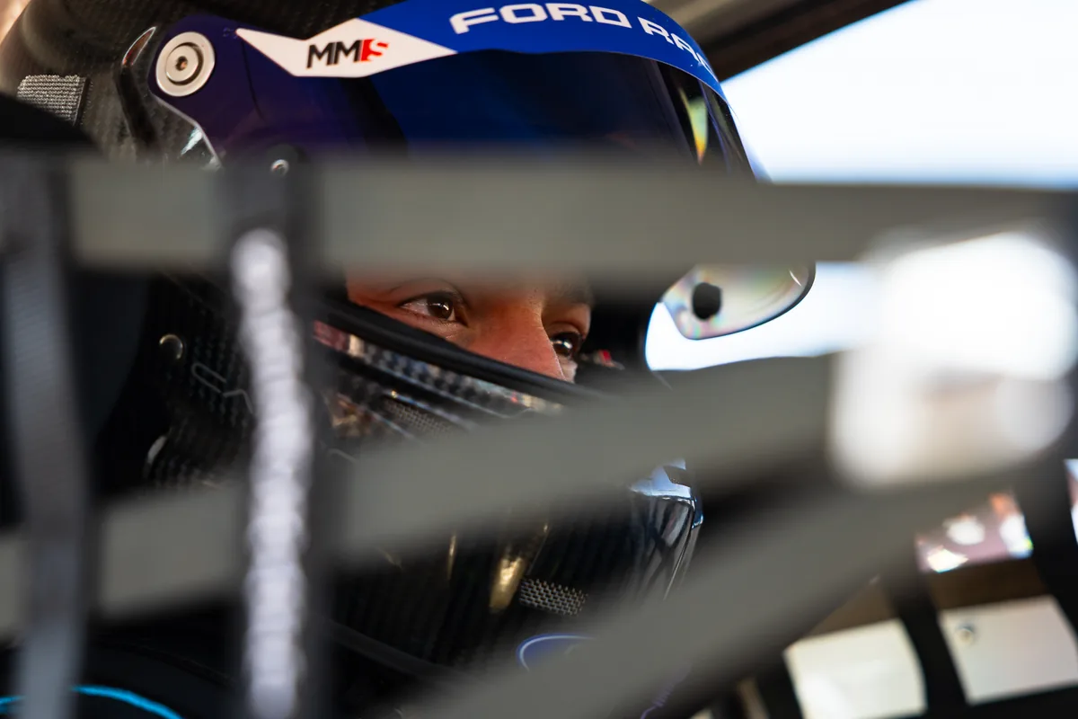 Blake Dowdall behind the visor in the #95 Ford Mustang GT4 cockpit