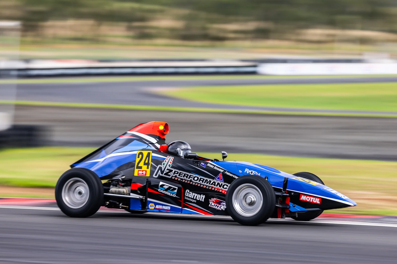 Blake Dowdall threads his #24 Formula First car through a corner at Hampton Downs.
