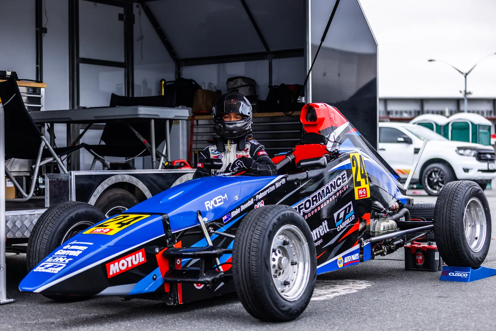 Blake Dowdall and his #24 Formula First car in the paddock at Hampton Downs.