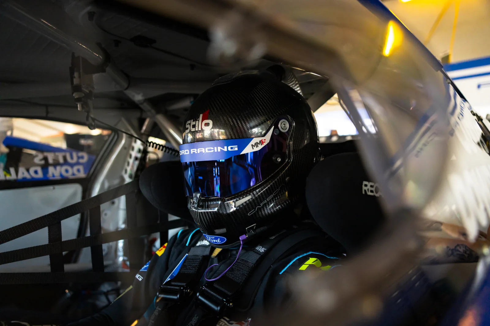 Blake Dowdall behind the visor in the #95 Ford Mustang GT4 cockpit at Hidden Valley