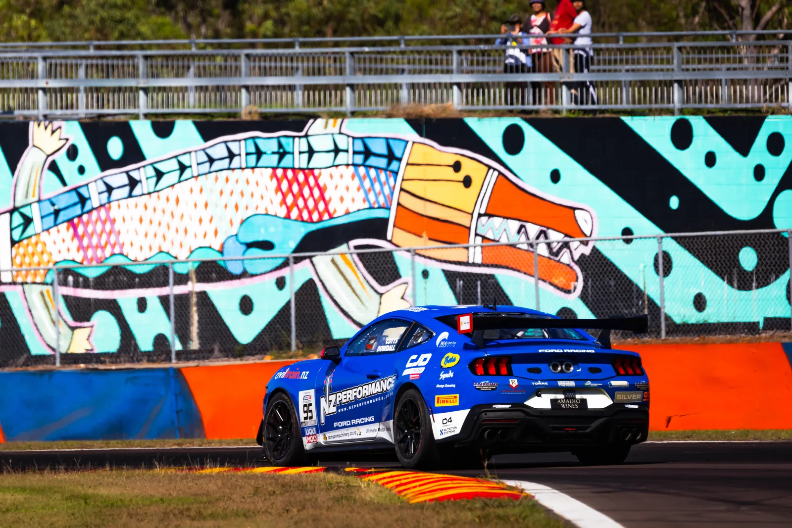 Blake Dowdall's #95 Ford Mustang GT4 passes the mural wall at Hidden Valley, Darwin