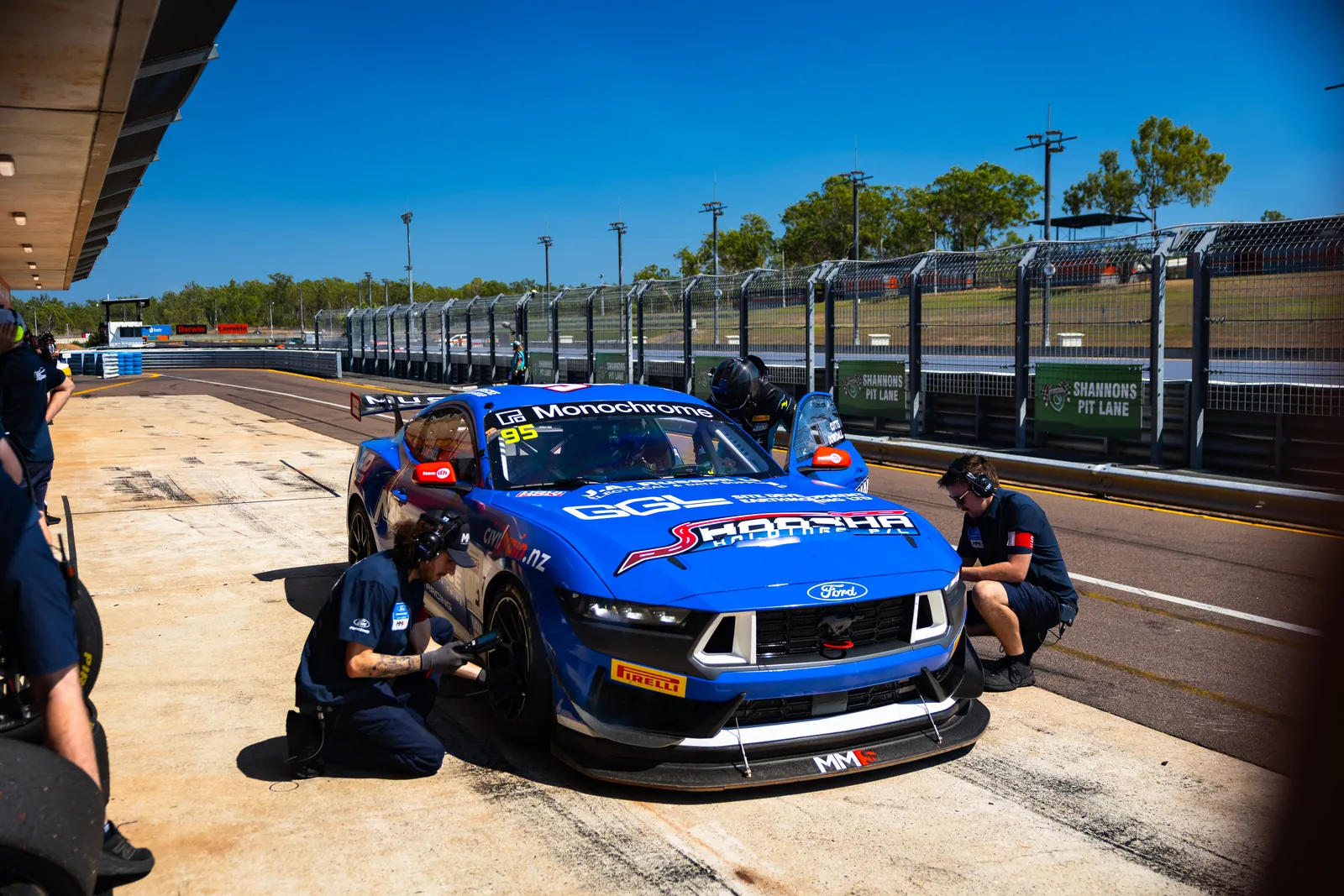 The Miedecke Motorsport crew service the #95 Ford Mustang GT4 during the pit stop at Hidden Valley