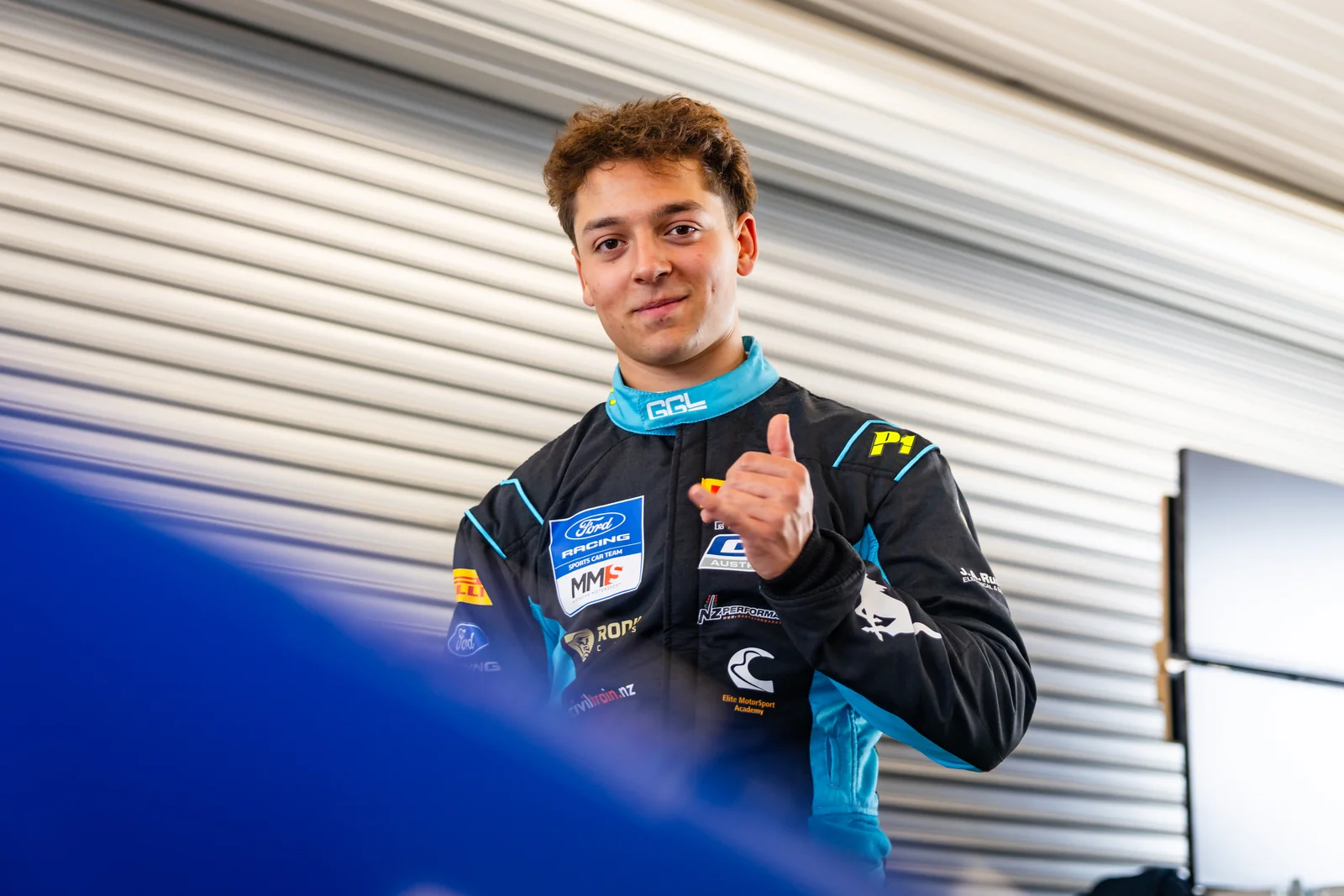 Blake Dowdall in his race suit at the 2026 GT4 Australia media day