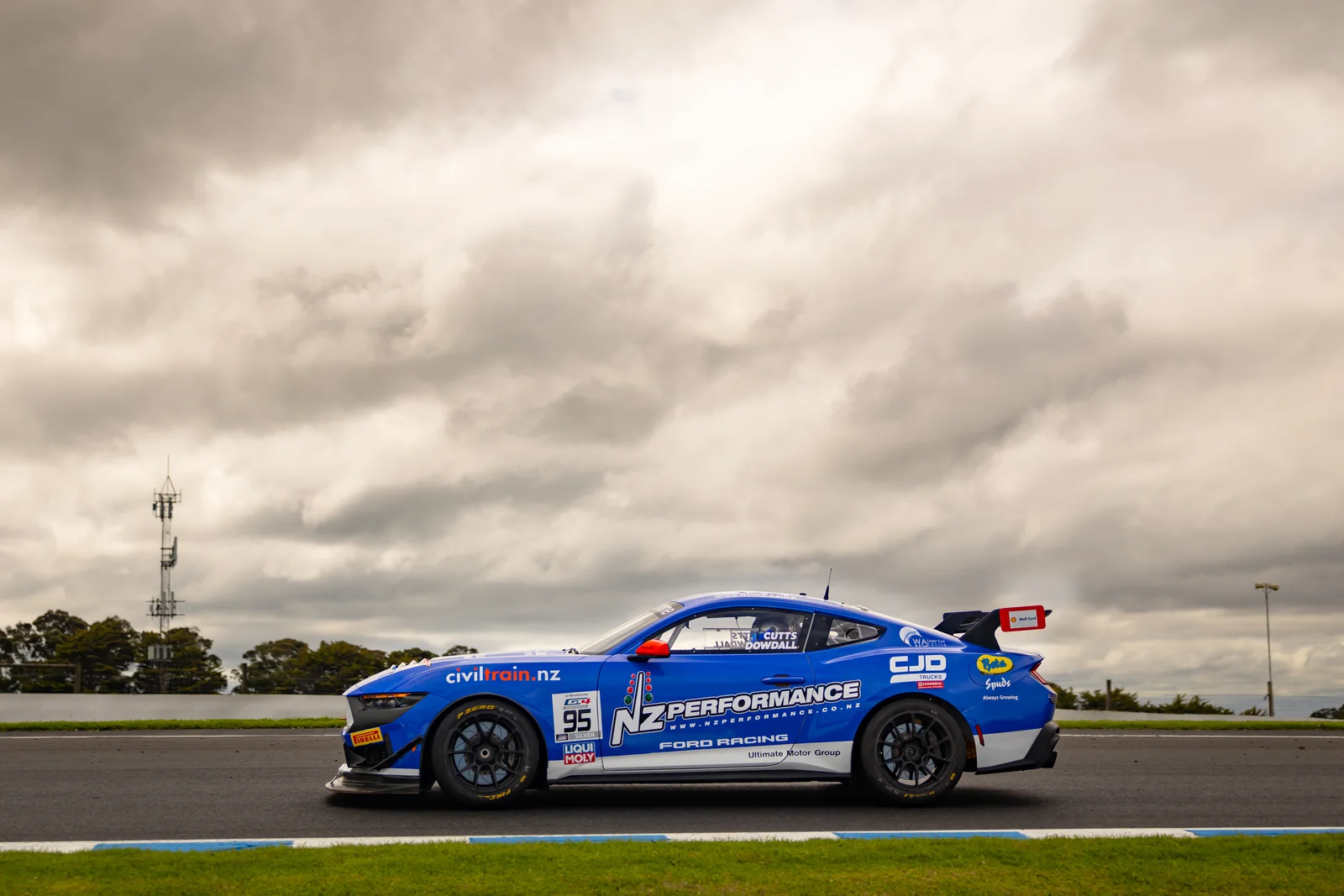 The #95 Ford Mustang GT4 under dramatic skies at Phillip Island