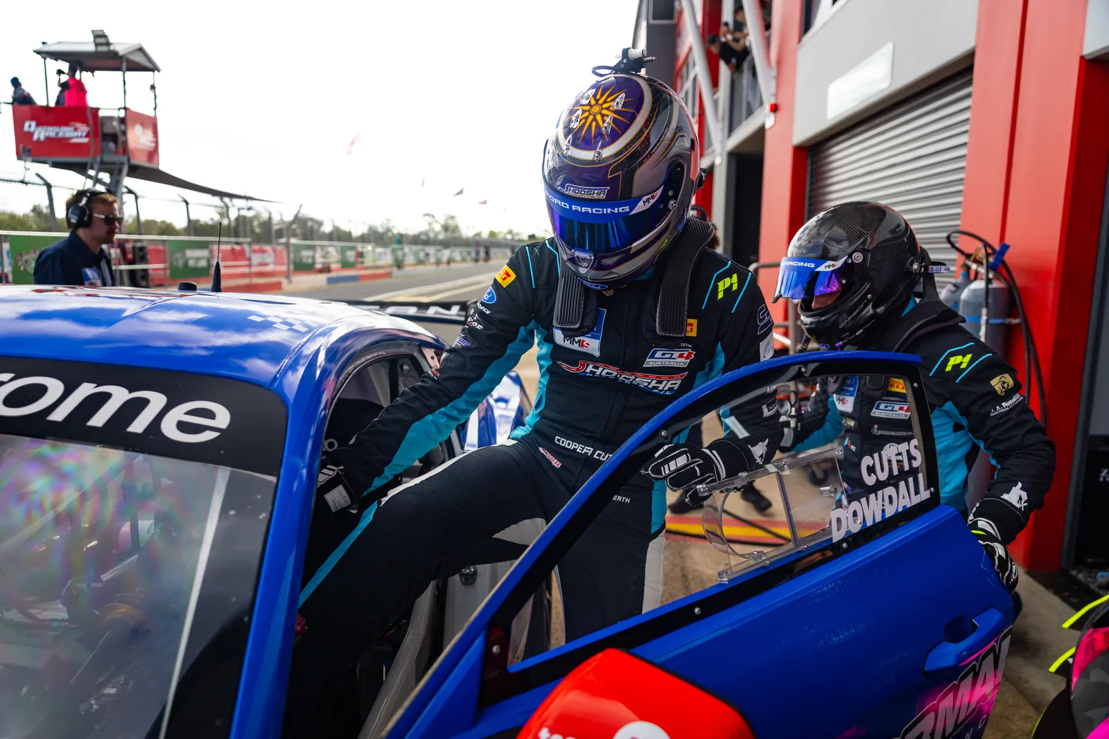 Blake Dowdall and Cooper Cutts practise a driver change at Queensland Raceway