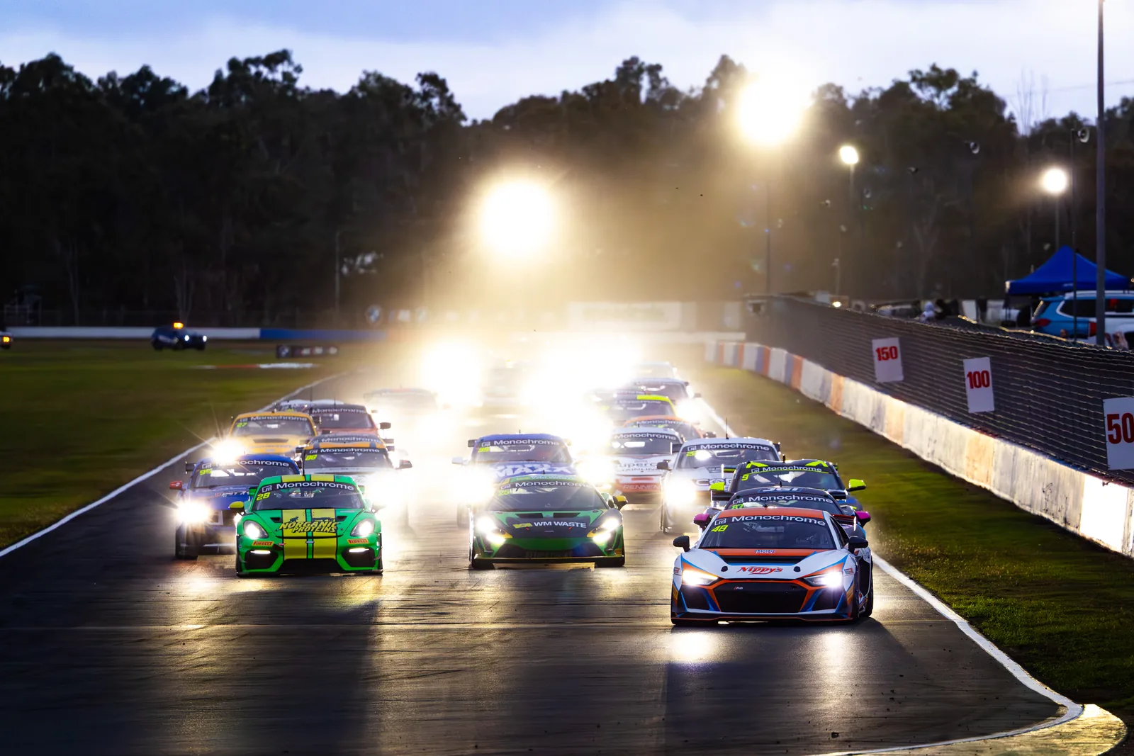 The GT4 Australia field starts the night race under lights at Queensland Raceway