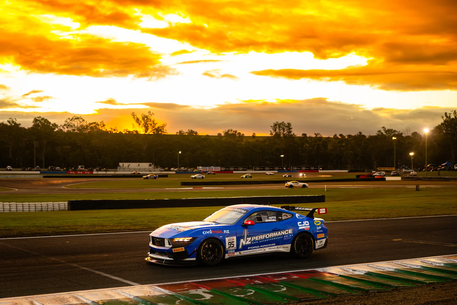 Blake Dowdall's Ford Mustang GT4 on track at sunset before the Queensland Raceway night race