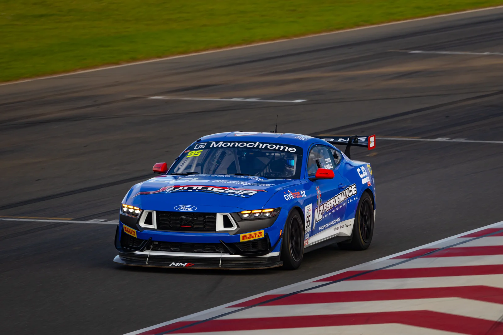 The #95 Ford Mustang GT4 on the kerbs at The Bend Motorsport Park