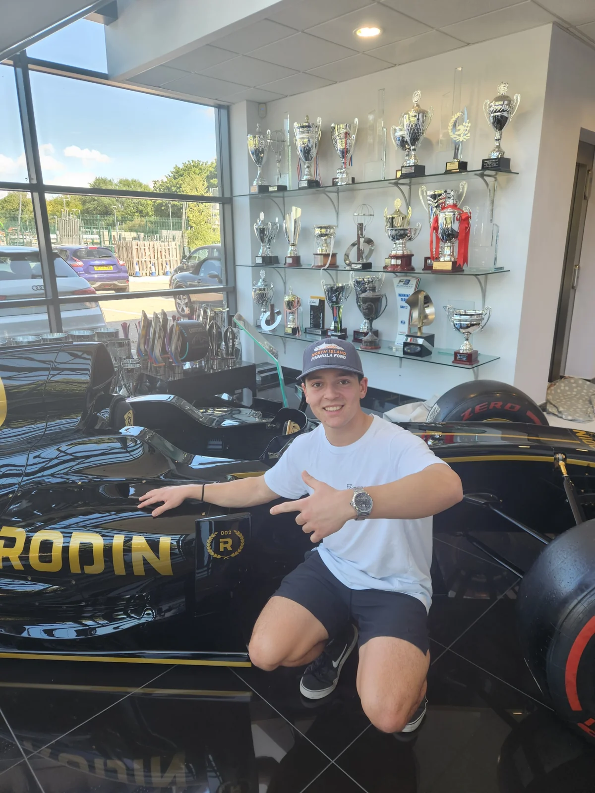 Blake Dowdall with the Rodin Motorsport trophy display