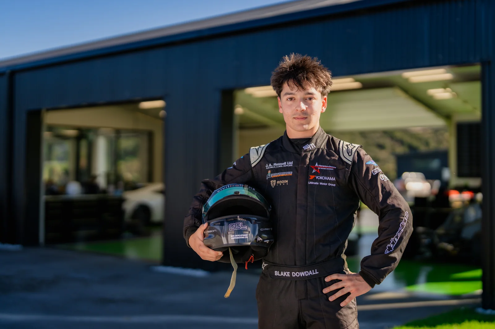 Blake Dowdall beside the Rodin Cars single-seater
